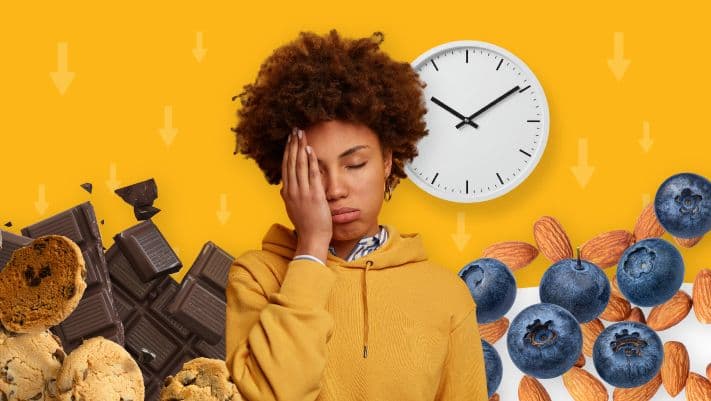 Fatigued woman resting her head with a wall clock and snack foods behind her, illustrating Britain's daily afternoon energy crash