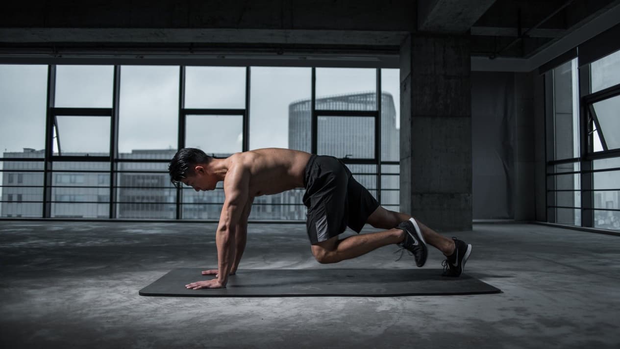 Man exercising on a gym mat